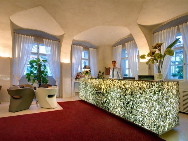 Three Storks Hotel Praha Bagian luar foto Reception desk at the Hotel Axelmannstein